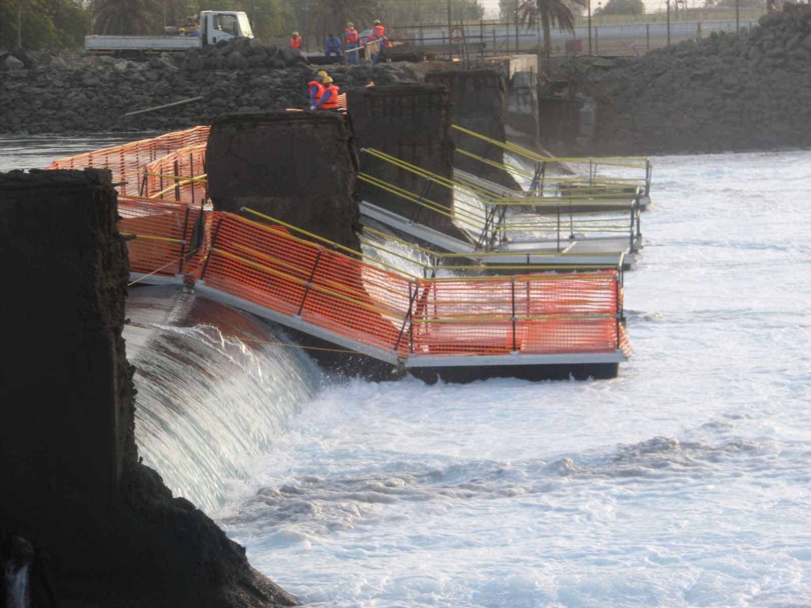 Walkway over fast-moving water at the Marafiq plant weir in Saudi Arabia