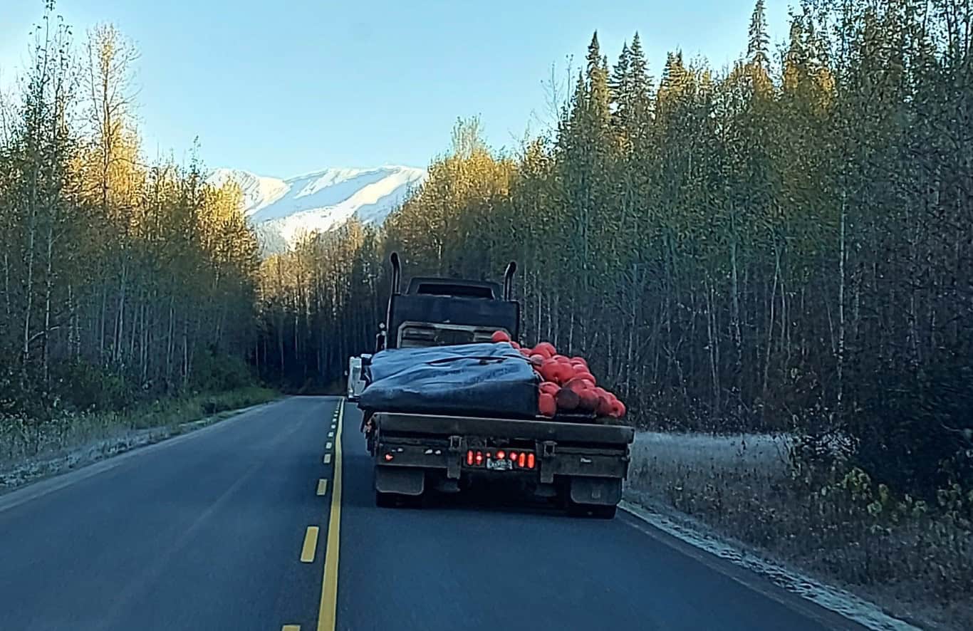 Truck carrying Xrosswater walkway sections on a forest road in Canada